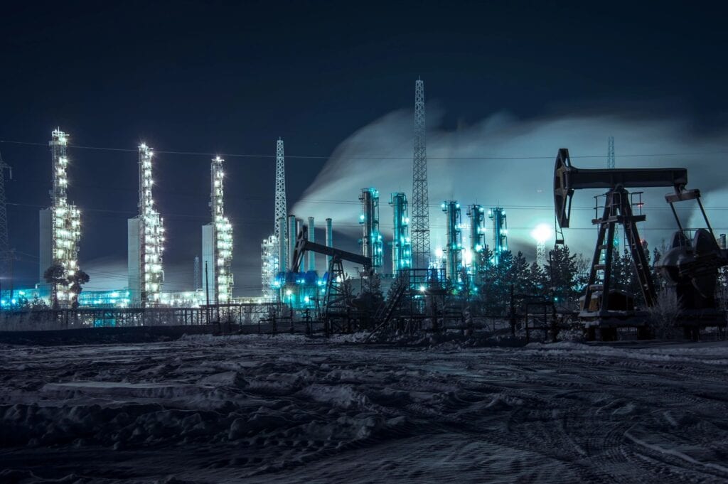 A night time scene of oil and gas fields.